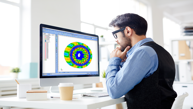 Engineer_Working_on_Simcenter_MAGNET An engineer working with Simcenter MAGNET