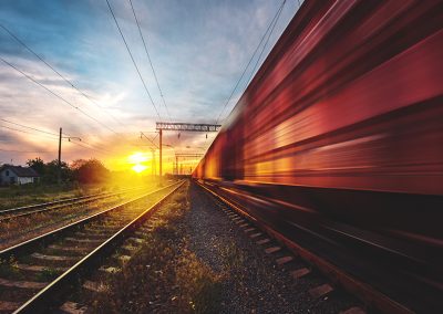 Changing the flow to bridge the gap: Rail car aerodynamics and drag