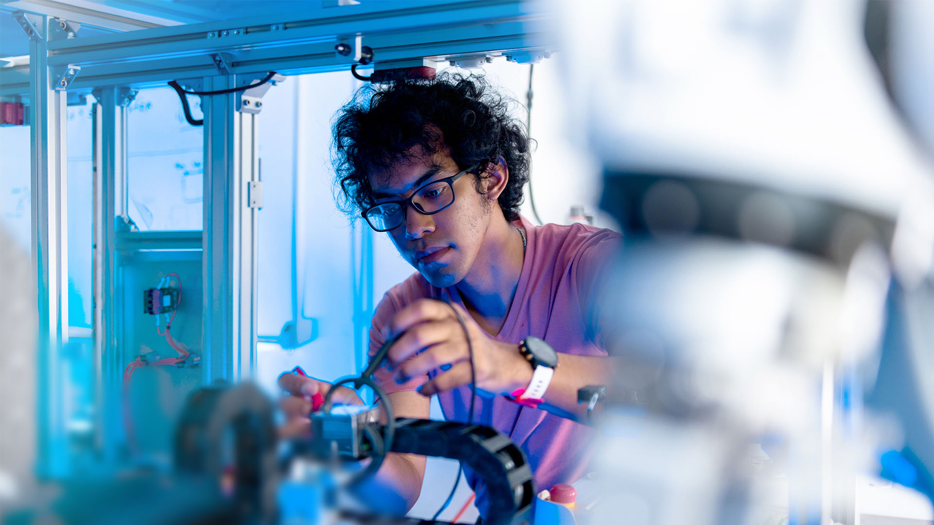 working-on-startup-program A person working on an electrical component